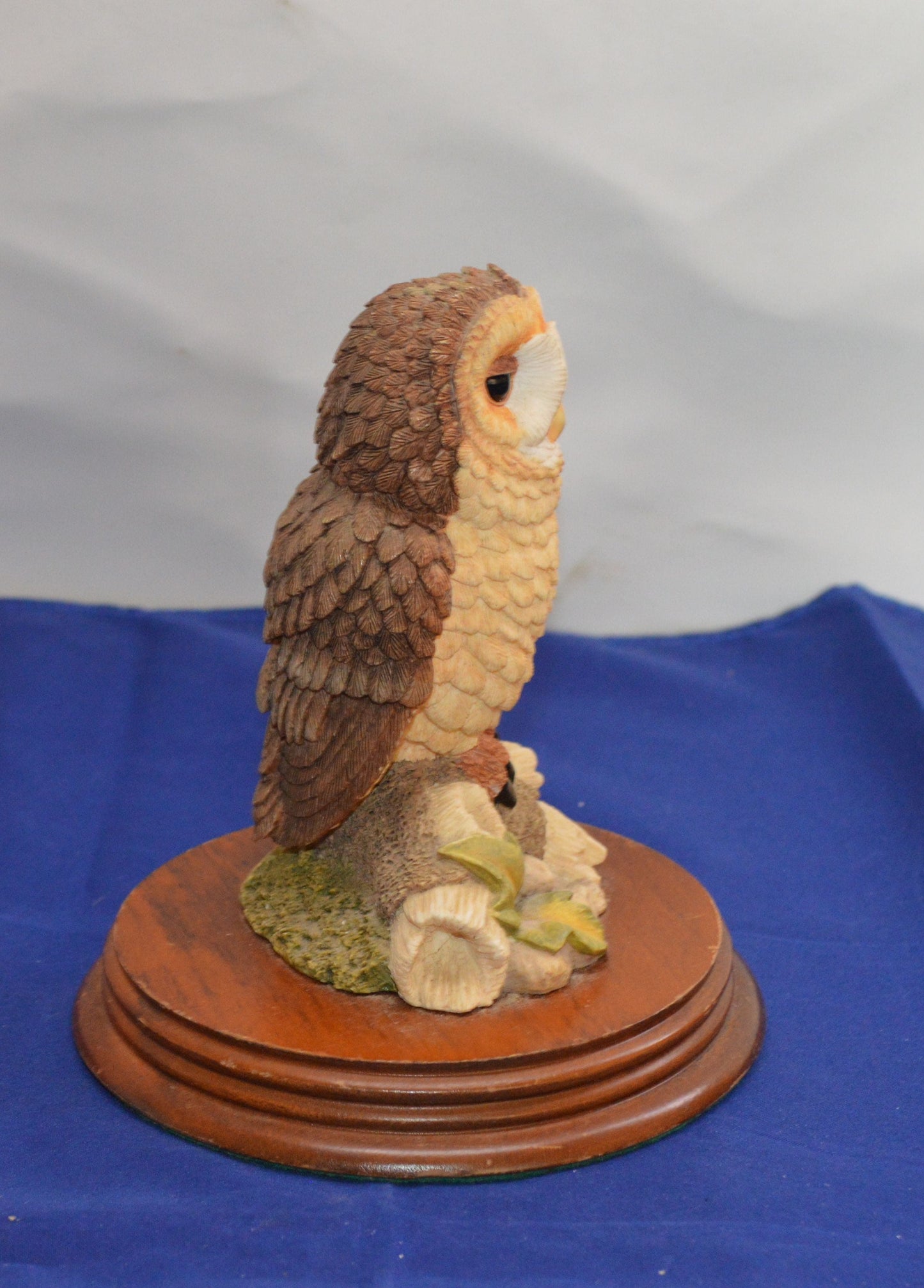 Side angle of The Leonardo Collection owl figurine, highlighting its textured feathers