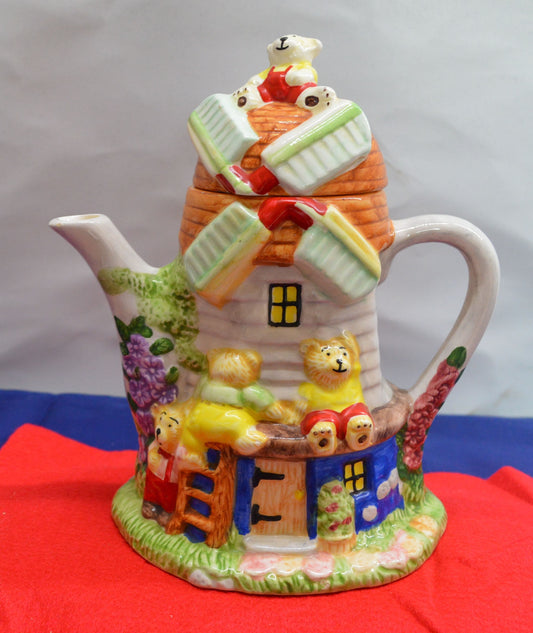 Vintage ceramic windmill teapot with teddy bear design, ideal for display or collectors