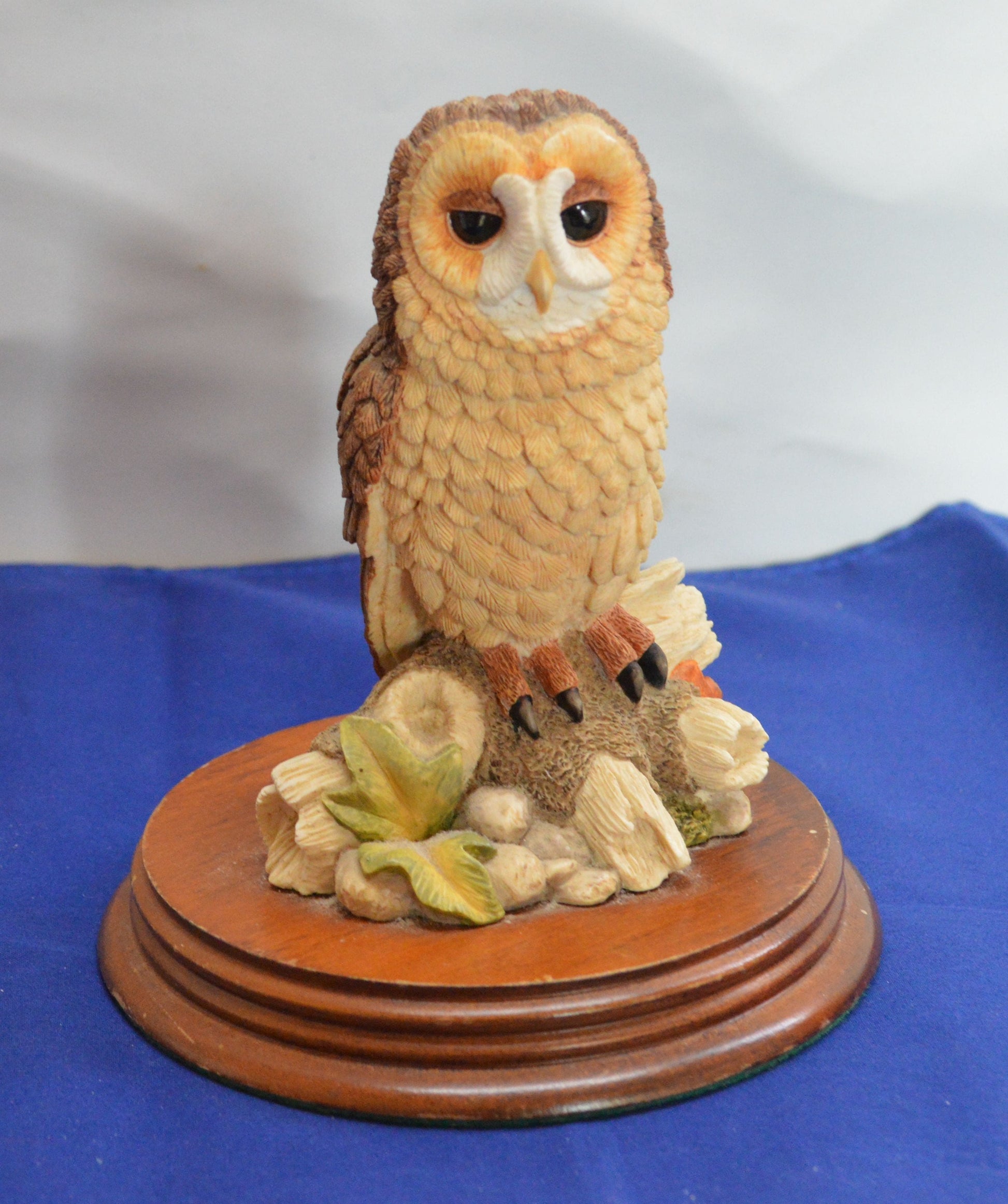 owl figurine from The Leonardo Collection, perched on a wooden base 