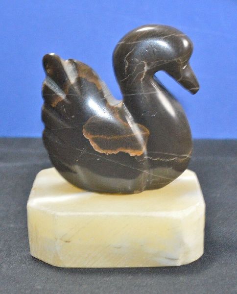 previously owned polished rock swan