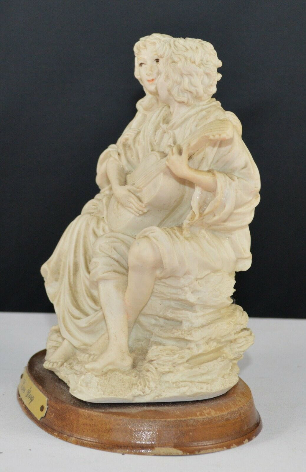 DECORATIVE FIGURINE MAN AND LADY FIGURINE ON WOODEN BASE TITLED LOVE STORY(PREVIOUSLY OWNED) GOOD CONDITION - TMD167207