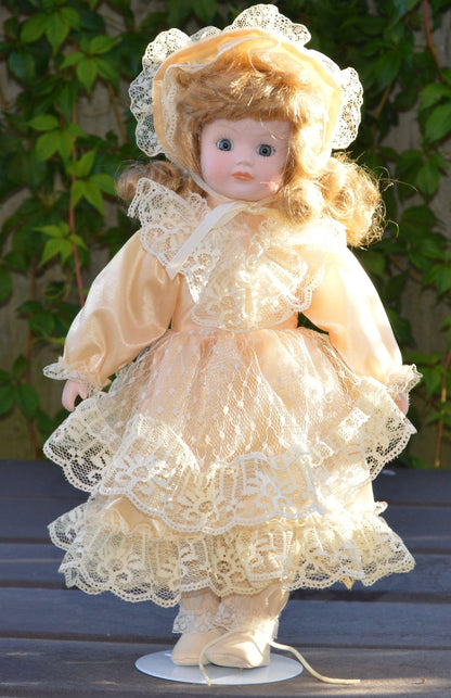 PORCELAIN DOLL IN A LIGHT PEACH DRESS - TMD167207