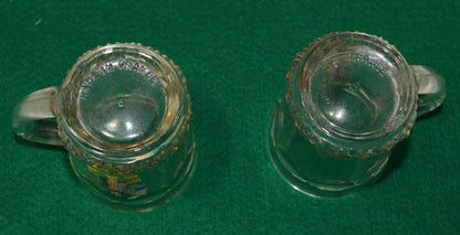 TWO MINIATURE GLASS TANKARDS DEPICTING THE TRADITIONAL COSTUME OF A WELSH LADY(PREVIOUSLY OWNED) GOOD CONDITION - TMD167207