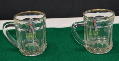 TWO MINIATURE GLASS TANKARDS DEPICTING THE TRADITIONAL COSTUME OF A WELSH LADY(PREVIOUSLY OWNED) GOOD CONDITION - TMD167207